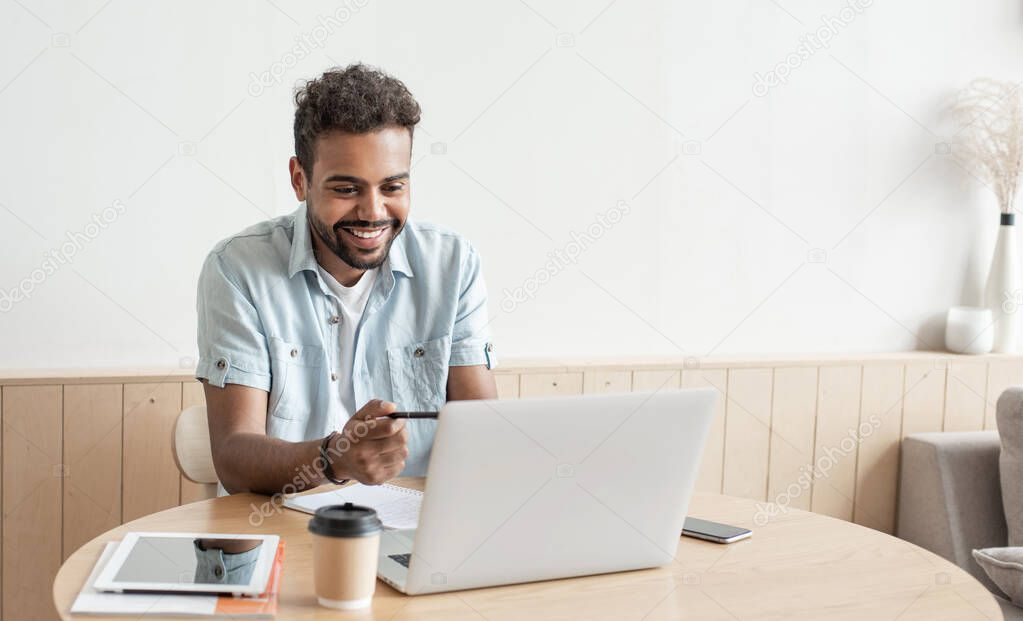 Young man having meeting online. Student men using laptop computer at home. Working, studying, distance education, communication online, social distancing concept