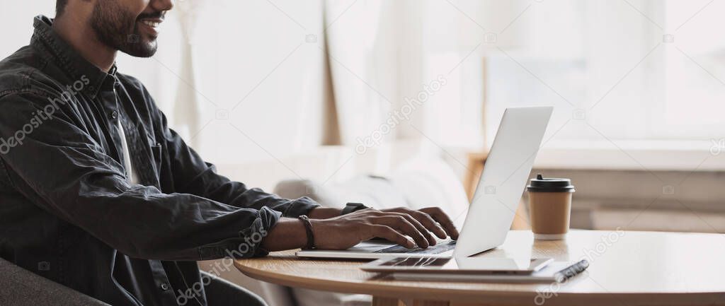 Man hands typing on computer keyboard closeup, businessman or student using laptop at home, panoramic banner, online learning, internet marketing, working from home, office workplace freelance concept