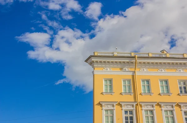 Part of historic building over blue sky — Stock Photo, Image
