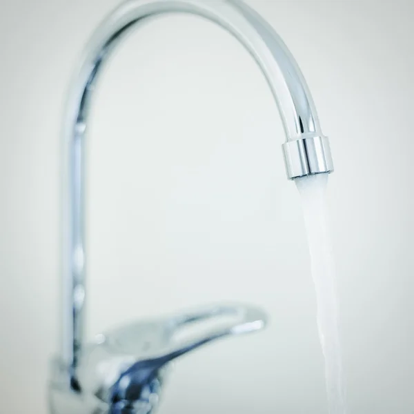 Kitchen shiny metallic faucet — Stock Photo, Image