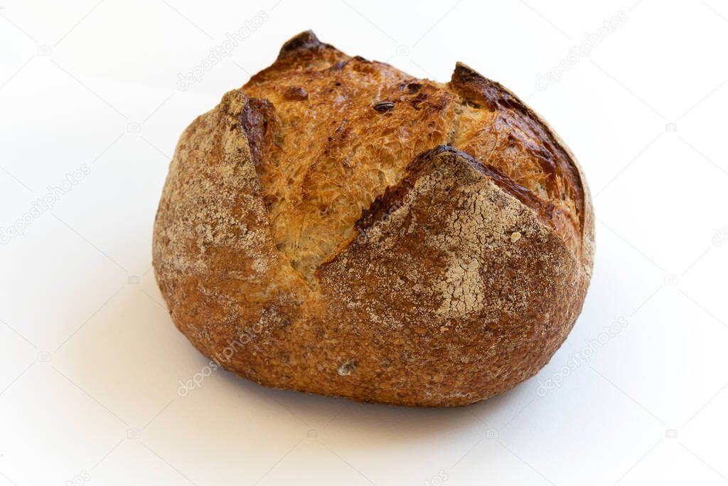 Homemade bread. Freshly baked round loaf of sourdough bread on a white background.