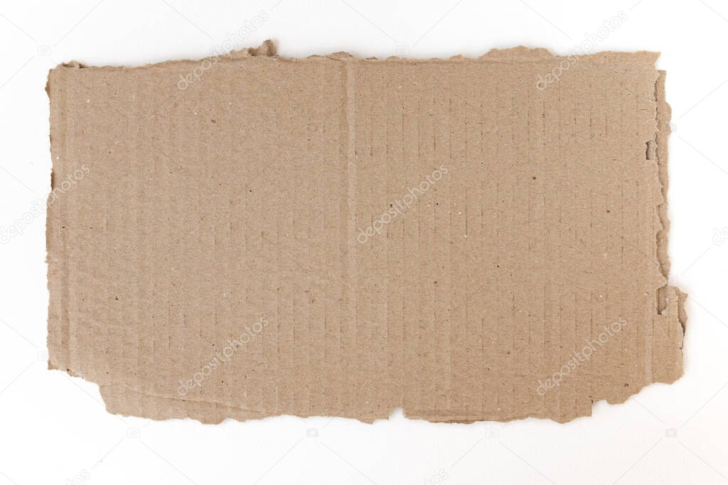 ripped piece of cardboard isolated on white background, cardboard with torn edges, top view