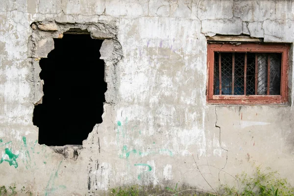 Hole in the wall of an old building