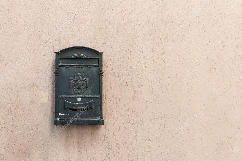Old mailbox with ancient logo and copy space