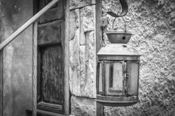 Old lantern in alley of castelsardo old city — Stock Photo, Image