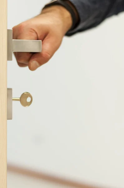 Door with an hand on the handle — Stock Photo, Image