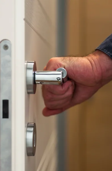 Door with an hand on the handle — Stock Photo, Image