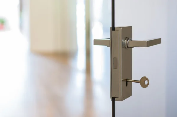 Modern, contemporary satin handle on a glass door — Stock Photo, Image