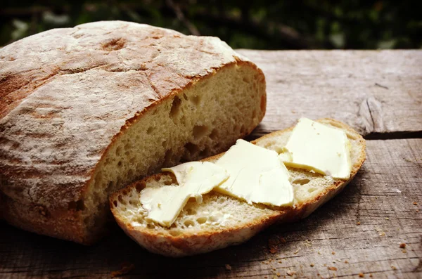 Fresh home made bread with butter with butter — Stock Photo, Image