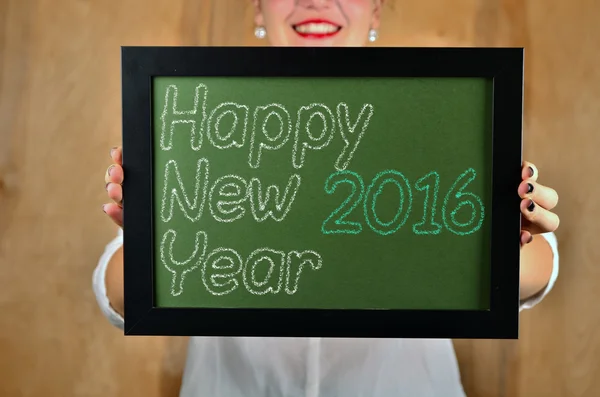 Happy New Year - white chalk text  on a vintage slate blackboard — Stock Photo, Image