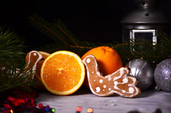 Christmas composition with  Christmas candle and oranges and fir tree, on wooden background — Stock Photo, Image