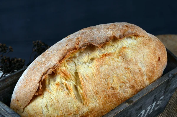 Bread on wooden table — Stock Photo, Image