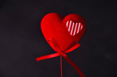 Half heart on wood background dark tone,black