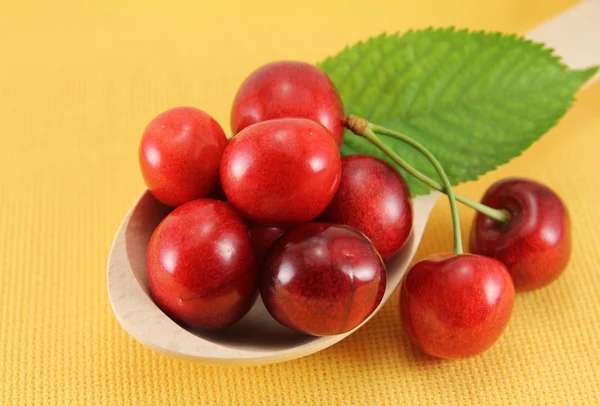 Abstract view cherry in a wooden spoon — Stock Fotó