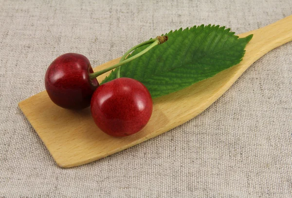 Abstract view cherry on wooden spatula — Stock Photo, Image