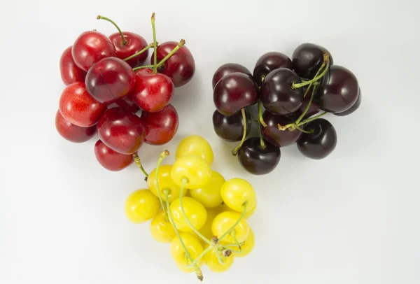 Colored handfuls of cherries (sweet cherry) — Stock Photo, Image