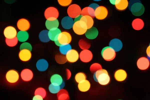 Coloured bokeh Christmas tree garlands (Christmas lights) — Stock Photo, Image
