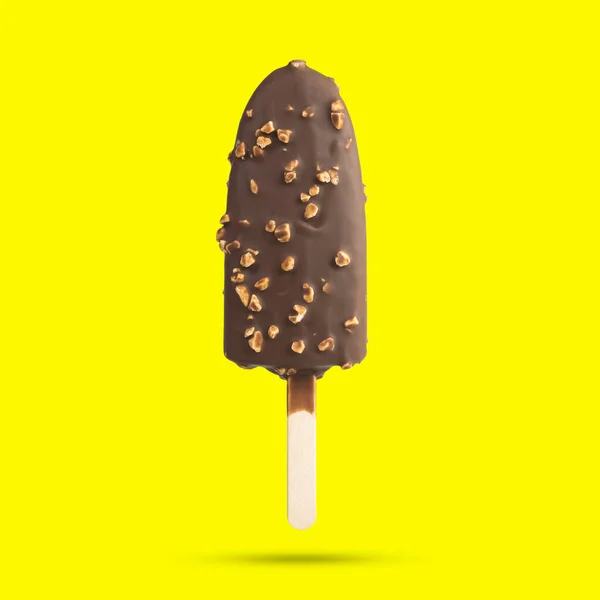 Ice cream stick chocolate vanilla and almonds isolated on yellow background with clipping paths.