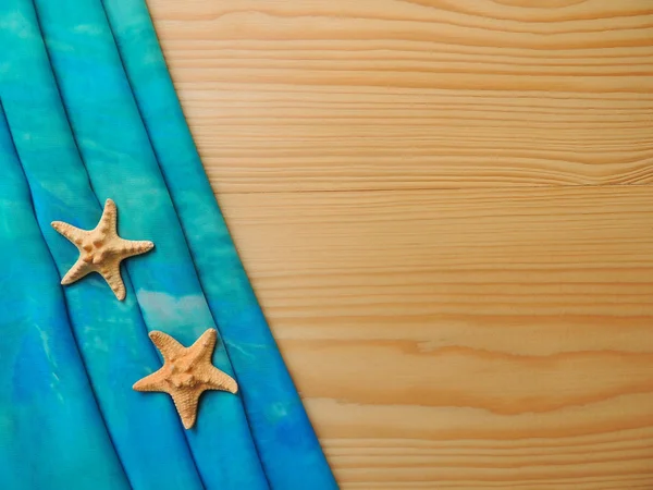 Sea turquoise fabric with starfish on the boards. — Stock Photo, Image