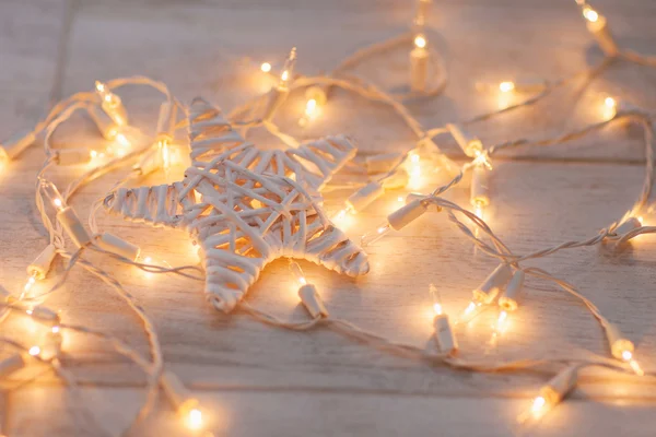 Wooden star and light — Stock Photo, Image