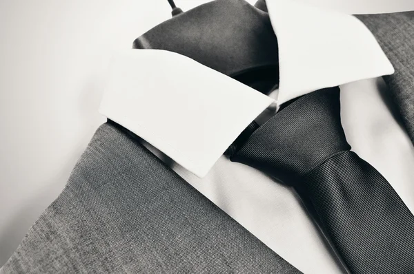 Black and white mens suit, collar and tie closeup. Stock Picture