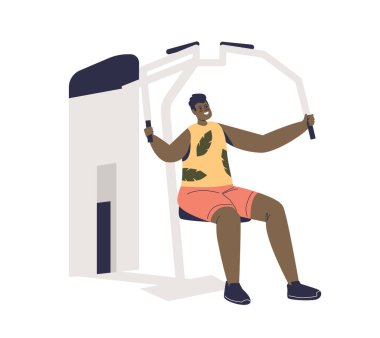 Spor aletleri üzerinde egzersiz yapan bir adam kol kaslarını çalıştırıyor. Antrenör aletinde genç bir erkek.