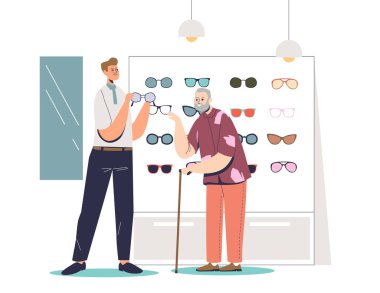 Son sınıf öğrencisi optik mağazasında gözlük seçiyor. Danışman, yaşlı erkeğin gözlük almasına yardım ediyor.