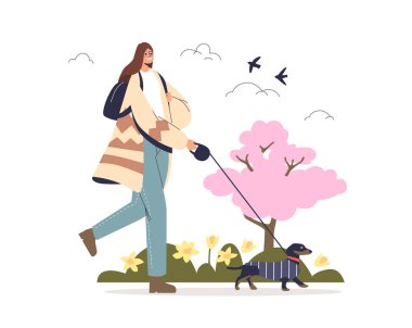 Bahar parkında, çiçeklerin ve ağaçların üzerinde köpeklerle gezen bir kadın.