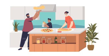 Anne, baba ve oğul, aile yemeği için İtalyan yemeği hazırlıyor.