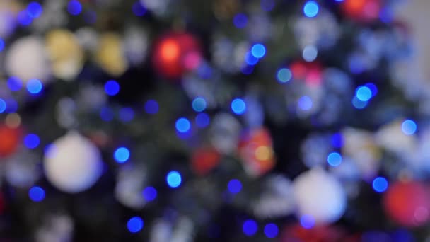 Arbre de Noël fond bokeh de lumières scintillantes déconcentrées — Video