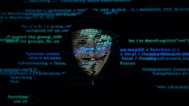 Anonymous hacker and programming code