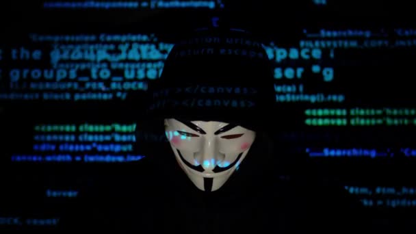 Zakapturzony haker z anonimową maską. — Wideo stockowe
