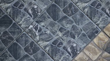 Kahverengi köşeli koyu gri desenli taş yüzeyi, taş kaplama döşemeleri kaplayan grafik kaynak yapı malzemelerinin dekoratif elementleri