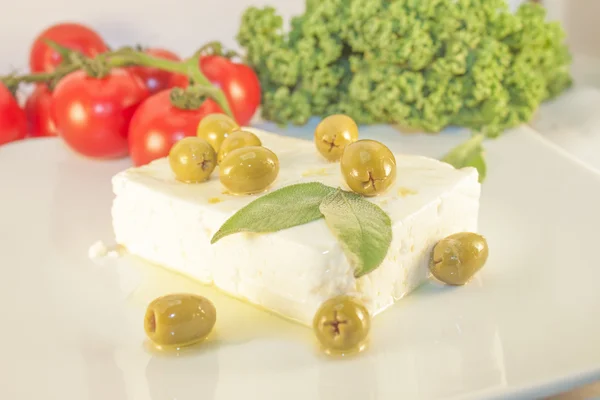 Feta cheese and green olives — Stock Photo, Image