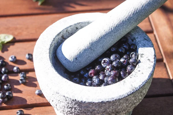 Blueberries in a mortar — Stock Photo, Image