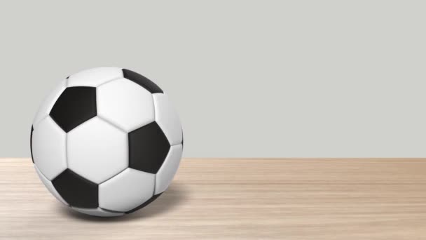 Realistic Soccer Ball Spinning Center Wood Table Wooden Footage Rotating — Stock Video