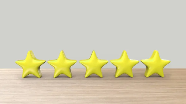 Five yellow stars on wooden table for review with white background