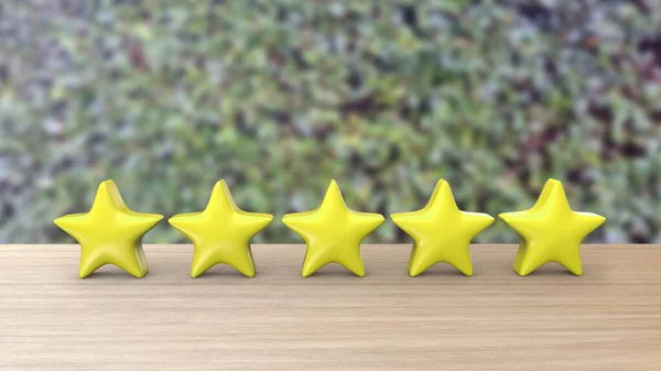 Five yellow stars on wooden table for review with hedge