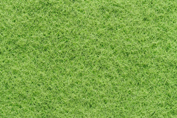 Bulaşık yıkamak için kullanılan yeşil plastik süngerin dokusu.