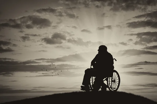 車椅子の障害者のシルエット — ストック写真