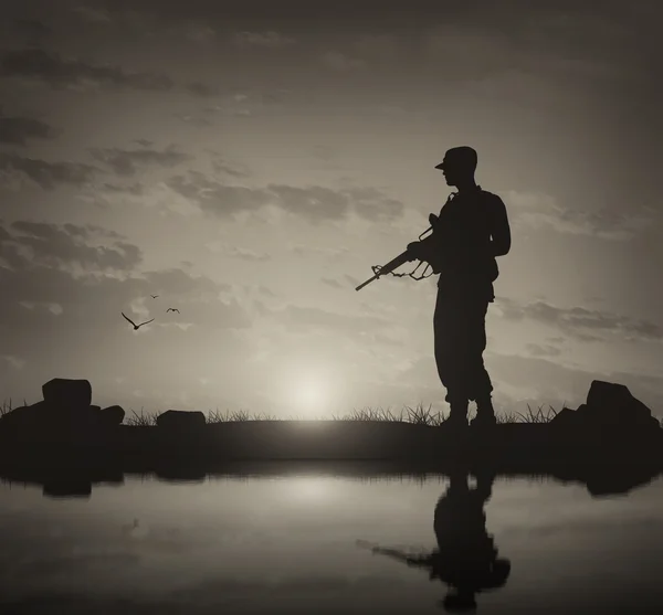 Silhouette of a terrorist with a weapon — Stock Photo, Image