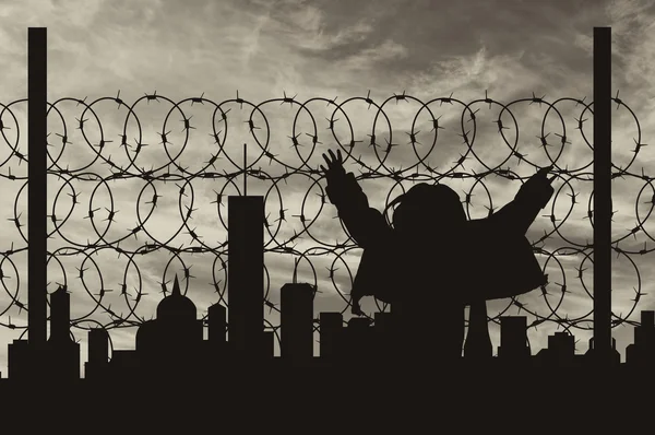 Silhouette refugee fence — Stock Photo, Image