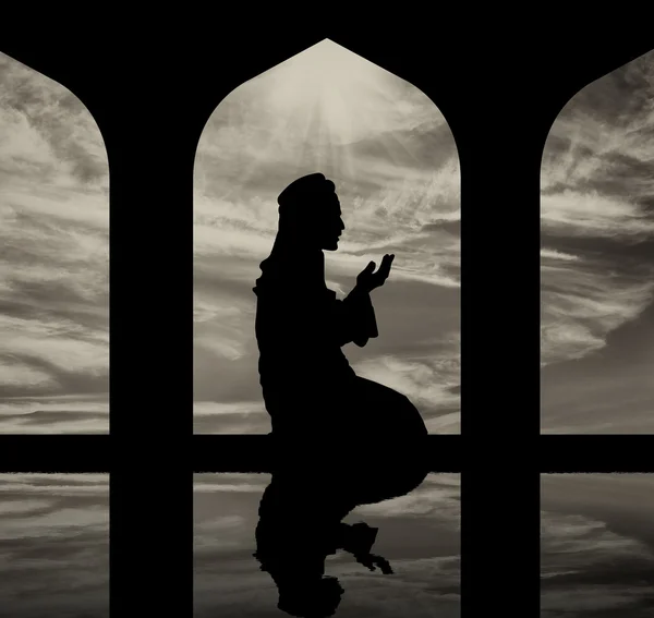 Silhouette of man praying at the Town Hall — Stock Photo, Image