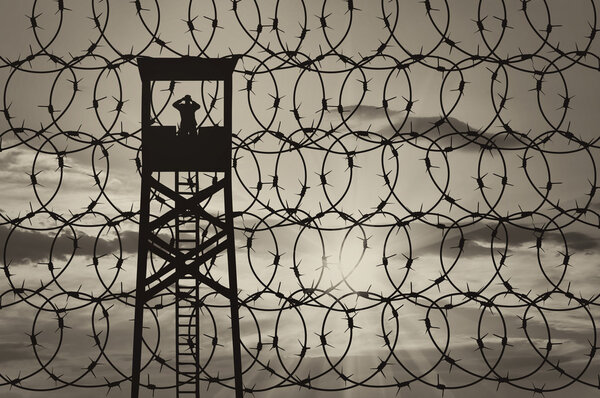 Silhouette of a lookout tower and borders