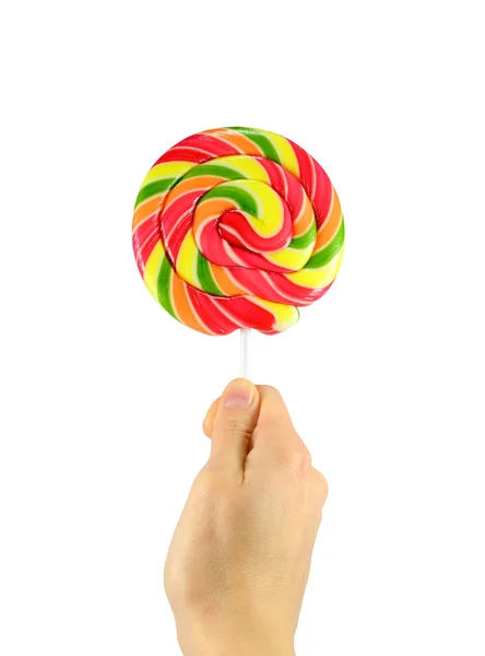 Round lollipop in hand — Stock Photo, Image