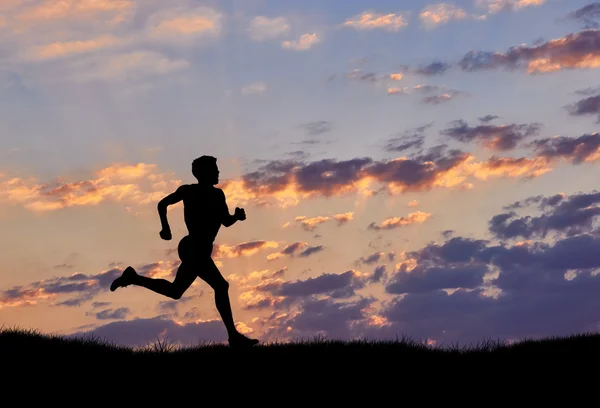 Silhouette of man runner at sunset — Stock Photo, Image