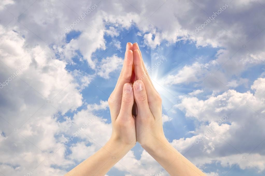 Two praying hands facing the sky Stock Photo by ©Prazisss 111633602
