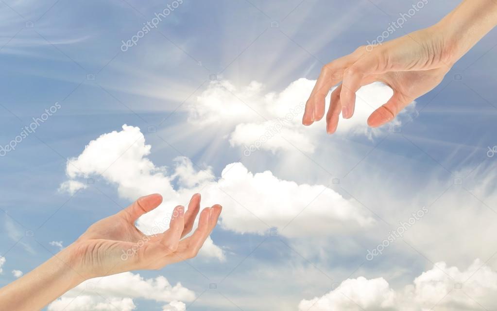 Two hands reaching out to each other Stock Photo by ©Prazisss 111634270