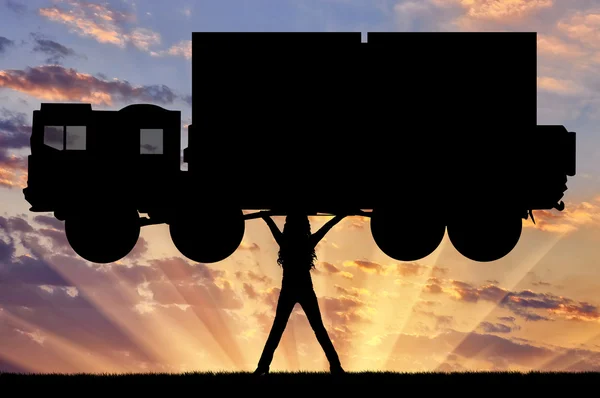 Silhouette of strong feminist, lifting trucks. — Stock Photo, Image