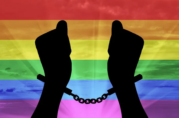 Silhouette gay hands in handcuffs — Stock Photo, Image